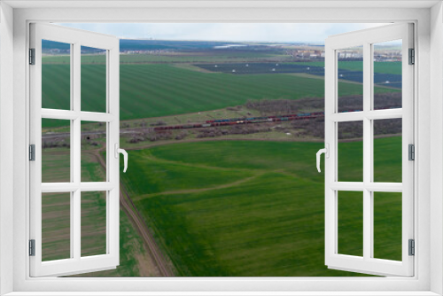 Fototapeta Naklejka Na Ścianę Okno 3D - Railway station and trains top view. Photo from a helicopter.