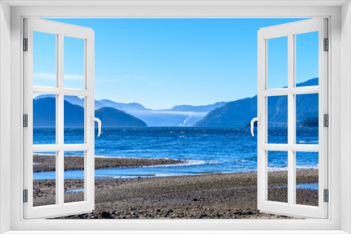 Fototapeta Naklejka Na Ścianę Okno 3D - Fantastic view over ocean, snow mountain and rocks at Furry Creek Dive Site in Vancouver, Canada.