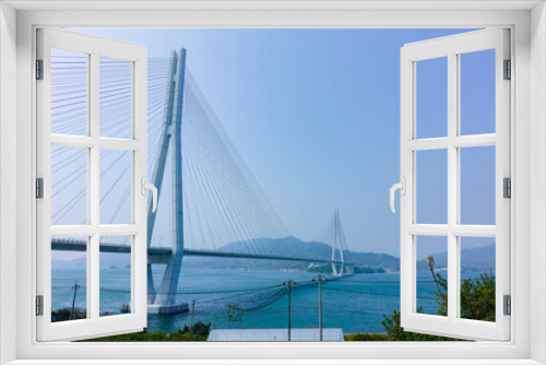 Fototapeta Naklejka Na Ścianę Okno 3D - Tatara ohashi bridge view from Setoda Sunset beach at Ikuchi island in Onomichi-city, Hiroshima, Japan