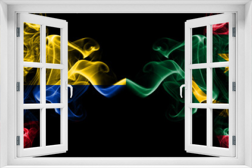 Colombia, Colombian vs Mauritania smoky mystic flags placed side by side. Thick colored silky abstract smokes flags.