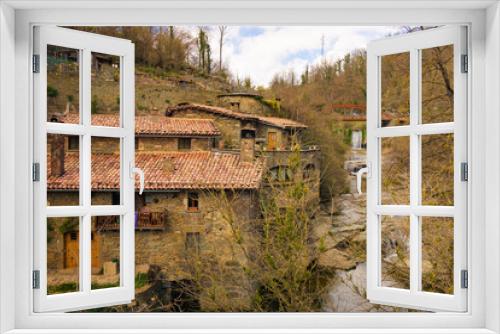 Fototapeta Naklejka Na Ścianę Okno 3D - View of the houses that line the banks of the Rupit stream, which were formerly used as mills to grind flour. Rupit, Catalonia, Spain
