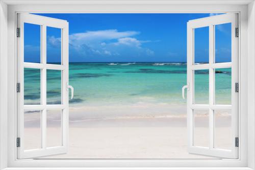 Fototapeta Naklejka Na Ścianę Okno 3D - Beautiful white sandy beach and turquoise waters of Caribbean sea in summer sunny day. Caribbean coast in the Playa del Carmen, Riviera Maya, Quintana Roo, Mexico. Soft focus