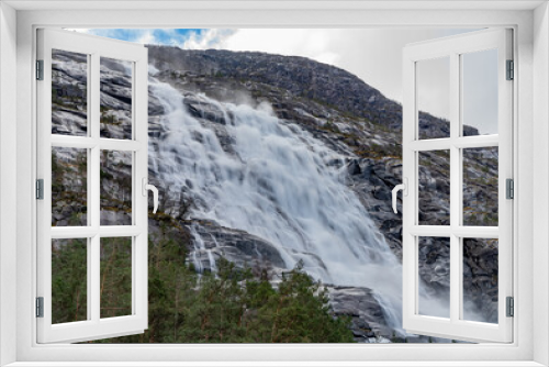 Fototapeta Naklejka Na Ścianę Okno 3D - Langfossen, a waterfall located in the municipality of Etne in Vestland County, Norway, Scandinavia