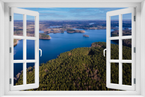 Fototapeta Naklejka Na Ścianę Okno 3D - Aerial view of forest and lake with blue water. Landscape of Latvia