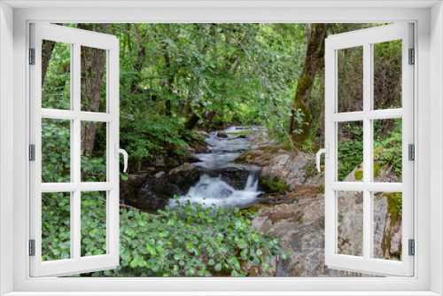 Fototapeta Naklejka Na Ścianę Okno 3D - The Murtigas River before passing under The Medieval Bridge of La Nava in the mountains of Huelva.