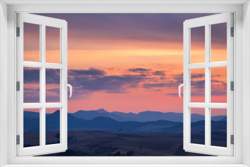 Fototapeta Naklejka Na Ścianę Okno 3D - Mountain rural landscape with colored clouds on a sky during a sunset. Rajecka valley in the north of Slovakia, Europe.