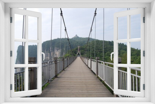 Fototapeta Naklejka Na Ścianę Okno 3D - suspension bridge in the mountains