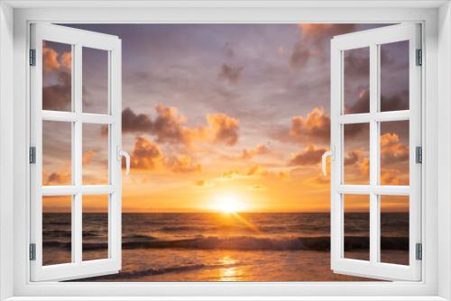 Fototapeta Naklejka Na Ścianę Okno 3D - A beautiful reflection of the sunset over the horizon between the sea and the sky with the clouds