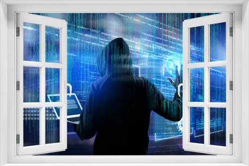 Man in hood with laptop and digital code on dark background. Cyber attack concept