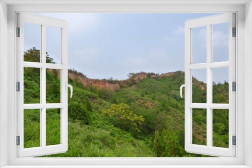 Fototapeta Naklejka Na Ścianę Okno 3D - A panoramic view on an unrenewed Gubeikou part of Great Wall of China. The wall is spreading on tops of mountains. Many watchtowers on the peaks. Dense forest around it. World wonder. Tradition