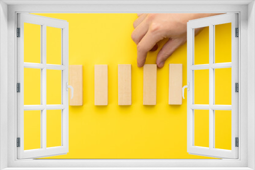 Fototapeta Naklejka Na Ścianę Okno 3D - blank wooden blocks stack over yellow background. business strategy template. step notes mockup. above view