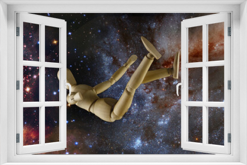 Fototapeta Naklejka Na Ścianę Okno 3D -  Falling manikin and DNA on the background of the starry sky. Elements of this image furnished by NASA. 3d-image.