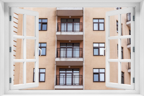 Fototapeta Naklejka Na Ścianę Okno 3D - Balconies and windows of the new apartment house.