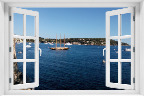 Fototapeta Naklejka Na Ścianę Okno 3D - Boats in harbor. Beautiful panoramic landscape of Villefranche-sur-mer on a sunny day. Wonderful trip to the Cote d'Azur in France. Scenic harbour view of city of sea country. Saint Jean cap Ferrat