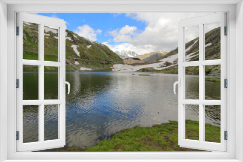 Fototapeta Naklejka Na Ścianę Okno 3D - Alpine lake in the mountains Col du Grand Saint Bernard border Italy/Switzerland