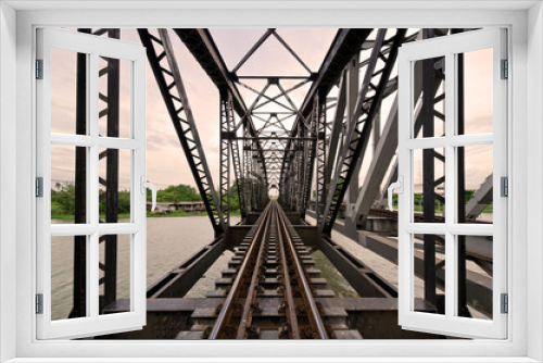 Fototapeta Naklejka Na Ścianę Okno 3D - Railway Bridge over the River Nakornchaisri Thailand
