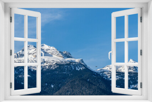 Fototapeta Naklejka Na Ścianę Okno 3D - Beautiful snow-capped Columbia Mountains against the blue sky in British Columbia Canada