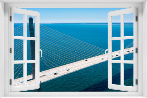 Fototapeta Naklejka Na Ścianę Okno 3D - Sunshine Skyway Bridge in Tampa Bay Florida. Large Suspension Bridge that ships pass underneath. Florida gulf coast fishing pier.