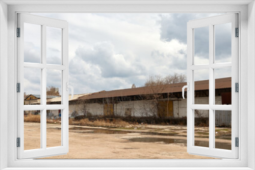 Fototapeta Naklejka Na Ścianę Okno 3D - old abandoned warehouse and yard empty yard 