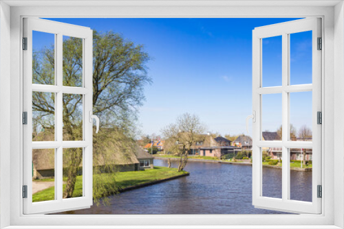 Fototapeta Naklejka Na Ścianę Okno 3D - Panorama of the canal in small village Warten, Netherlands