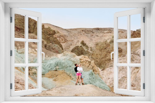 Fototapeta Naklejka Na Ścianę Okno 3D - A family is hiking and enjoying the views in Death Valley national park in California, USA. It’s March 2021, the weather is warm and sunny. The views are stunning and the sand desert is spectacular.