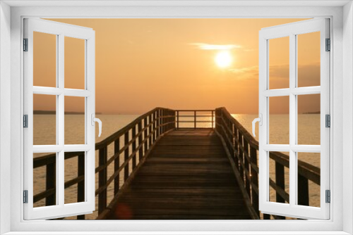 Fototapeta Naklejka Na Ścianę Okno 3D - Romantic seascape with wooden walkway in golden light