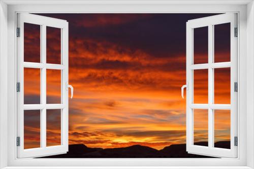 Colorful sky during sunset in the Sahara Desert. Morocco. Beautiful red sky.