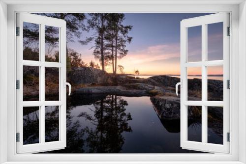 Fototapeta Naklejka Na Ścianę Okno 3D - Puddles on the cliffs reflect the grandeur and tranquility of the Ladoga nature