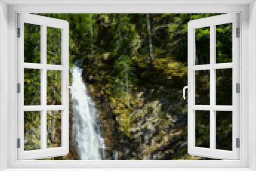Fototapeta Naklejka Na Ścianę Okno 3D - Vertical panorama of Scorusu waterfall flowing out of the spruce forest on a vertical cliff. Capatanii Mountains, Carpathians, Romania.
