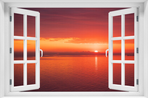 Fototapeta Naklejka Na Ścianę Okno 3D - Magic of the morning the first rays of the rising sun in pink and orange colors of a summer day while on vacation. Meditation and relaxation