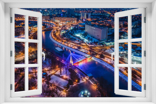 Fototapeta Naklejka Na Ścianę Okno 3D - Bridge across river in illuminated park Strelka in Kharkiv