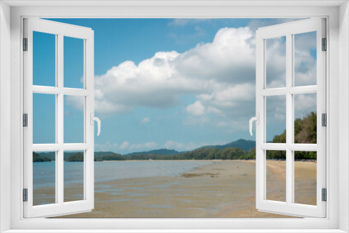 Fototapeta Naklejka Na Ścianę Okno 3D - Landscape of sea sand beach under blue sky and white fluffy clouds, mountain on background