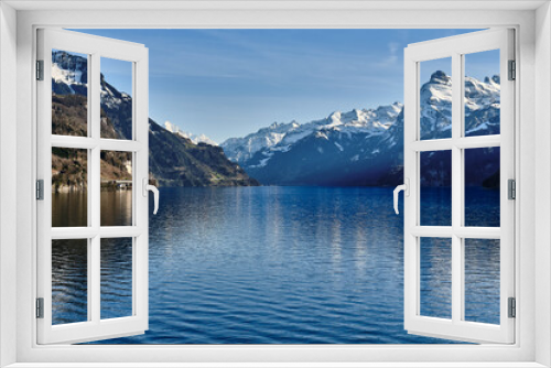 Fototapeta Naklejka Na Ścianę Okno 3D - Scenic View Of Lake And Snowcapped Montains Against Sky