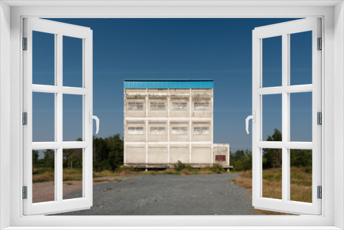 Fototapeta Naklejka Na Ścianę Okno 3D - Abandoned Mysterious Building apart on sultry land