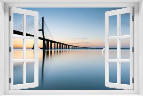 Fototapeta Naklejka Na Ścianę Okno 3D - Sunrise at Vasco da Gama bridge 