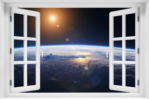 Fototapeta Naklejka Na Ścianę Okno 3D - Surface of planet Earth in space. Orbit of planet. Sunrise on Earth. Sky, clouds and ocean. Sun and stars. Elements of this image furnished by NASA
