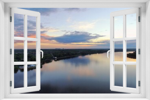 Fototapeta Naklejka Na Ścianę Okno 3D - Aerial view sunset on the river. Colorful clouds are reflected in the water. Beautiful panorama of nature at sunset.