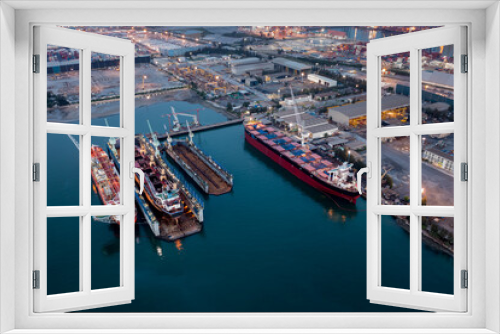 Fototapeta Naklejka Na Ścianę Okno 3D - Aerial view Container ship repair in shipyard at twilight over lighting