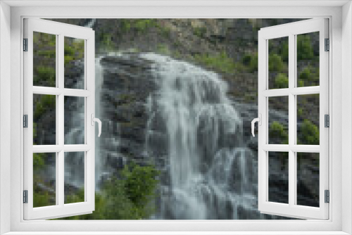 Fototapeta Naklejka Na Ścianę Okno 3D - beautiful waterfalls with crystal clear water with mountains in the background at sunset Norway.