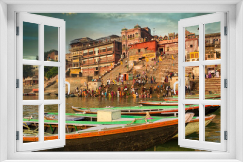 Fototapeta Naklejka Na Ścianę Okno 3D - Varanasi, India : Dashashwamedh Ghat is the main ghat on the Ganga River in Uttar Pradesh. It is located close to Vishwanath Temple. People participating in holy rituals.