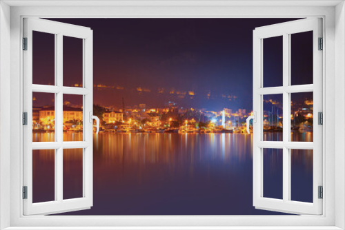 Fototapeta Naklejka Na Ścianę Okno 3D - Resort town of Fethiye city lights reflection on the water with lot of boat -  Fethiye, Turkey