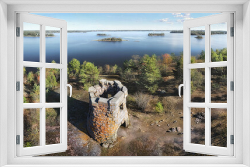 Fototapeta Naklejka Na Ścianę Okno 3D - unknown medieval Swedish watchtower at cliff of small uninhabited island. Drone view in Vyborg bay, gulf of Finland.