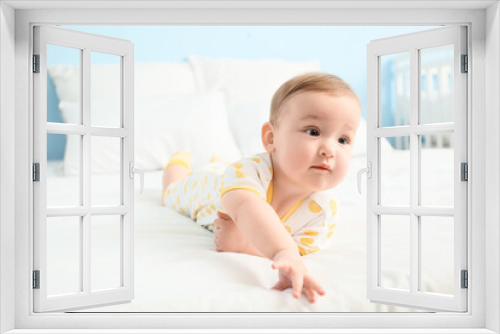 Cute little baby lying on bed, closeup