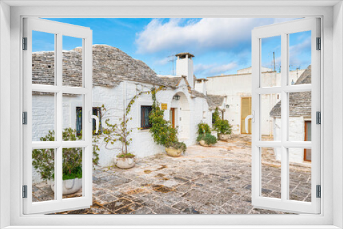 Fototapeta Naklejka Na Ścianę Okno 3D - Malownicze miasteczko we Włoszech z pięknymi domkami - Alberobello