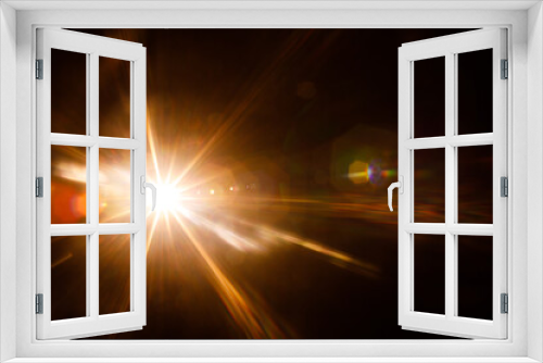 Fototapeta Naklejka Na Ścianę Okno 3D - Easy to add lens flare effects for overlay designs or screen blending mode to make high-quality images. Abstract sun burst, digital flare, iridescent glare over black background.