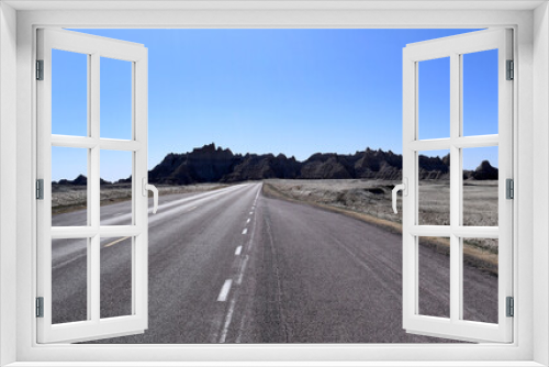 Fototapeta Naklejka Na Ścianę Okno 3D - Road to nowhere in the badlands.