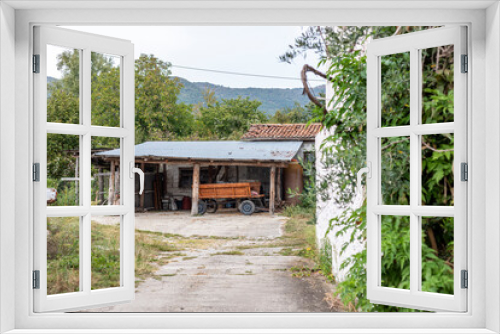 Fototapeta Naklejka Na Ścianę Okno 3D - View of an old garage in a village in Greece