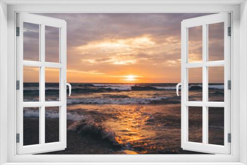 Fototapeta Naklejka Na Ścianę Okno 3D - Scenic view of sunset and endless wavy sea