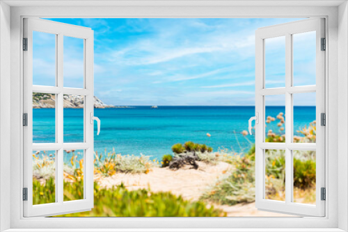 Fototapeta Naklejka Na Ścianę Okno 3D - (Focus in the Background) Stunning view of a blurred coastline bathed by a turquoise, clear sea. Rena Majore is a small seaside village that's located south of Santa Teresa Gallura, Sardinia, Italy.