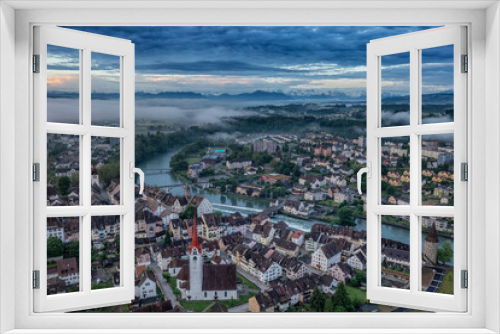 Fototapeta Naklejka Na Ścianę Okno 3D - aerial view of a medieval town and the alps 